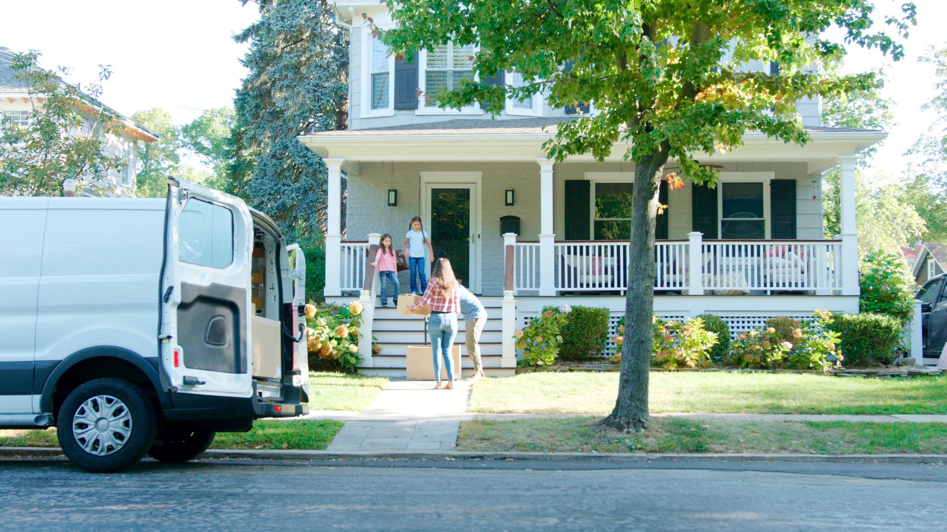 Happy family moving into their new home