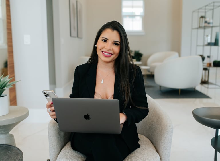Anyelina Domingos Cohen, Broker Owner of Proserve Realty Group in professional attire